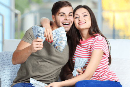 couple with cash from six figure affiliate marketing