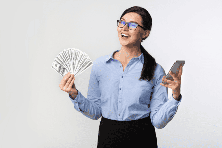 woman with phone and cash from highest paying survey sites