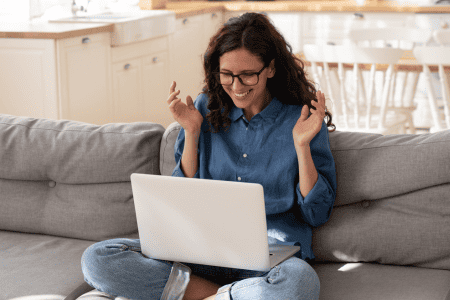 lady happy with laptop and click a snap review