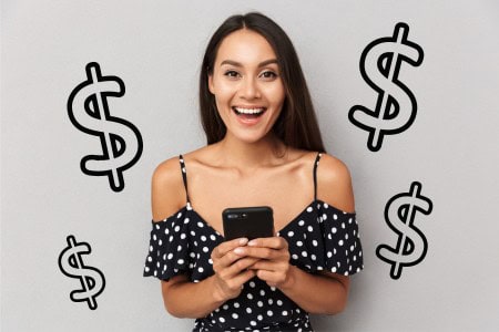woman holding phone and making money online