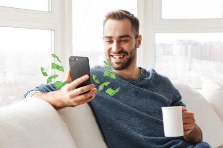 man making money with surveys on his phone