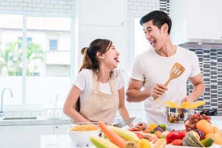 couple cooking cheap meals for family of 2