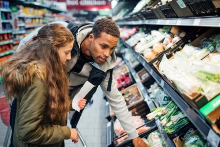 man and woman grocery shopping