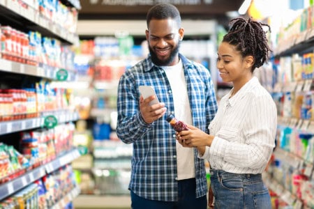 man and woman looking at dollar tree food