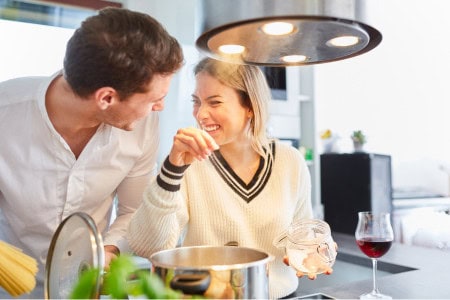 man and woman preparing food