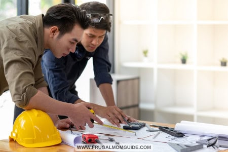 2 contractors reviewing paperwork
