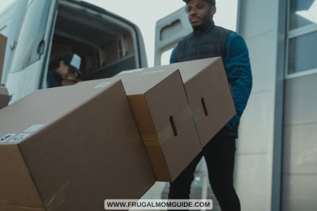 delivery man with boxes and van