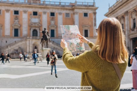 female tour guide pointing at map