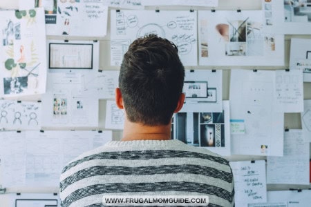 man planning a few small business ideas on a board