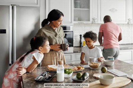 mom, dad, teen boy and girl preparing a cheap family dinner