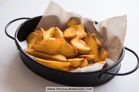 seasoned potato wedges in tray