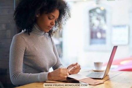 woman with laptop designing digital products to sell