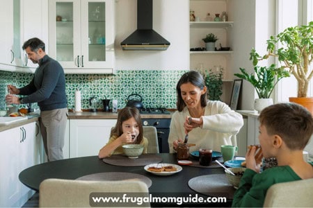 family with young boy and girl eating toast