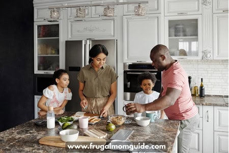 family with young boy and girl in kitchen