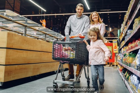 man, woman and young girl with a shopping cart