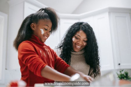 mother and daughter meal planning in kitchen