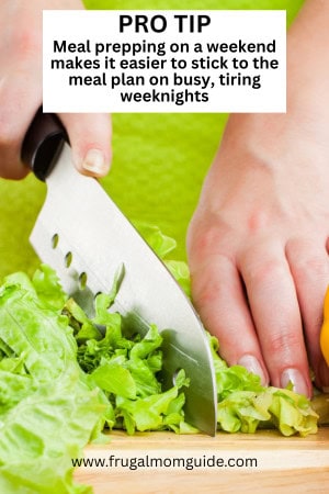 woman cutting lettuce meal prepping
